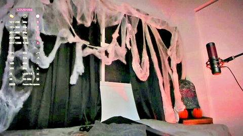 Gothic Halloween webcam room with cobwebs, black curtains, mic stand and love chat overlays