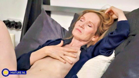 Milka Way mature blonde topless in open shirt on bed