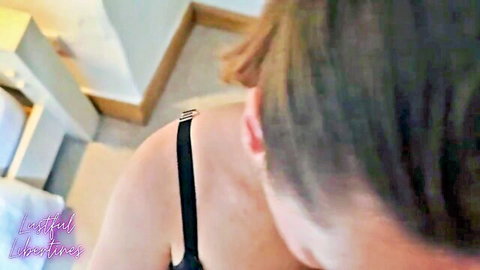 Lustful Libertines in black lingerie, seductive back view with bra strap