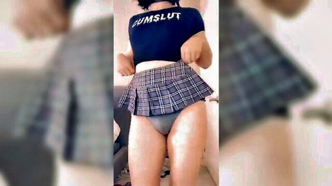 Hot femboy in cumslut shirt and plaid schoolgirl skirt teasing with lifted hem