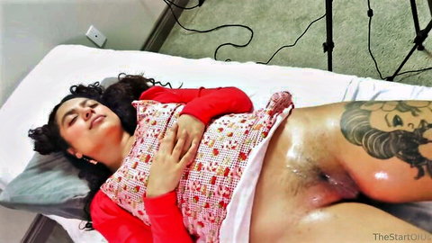 Brunette Latina lies exposed with cum on hairy pussy in clinic passion