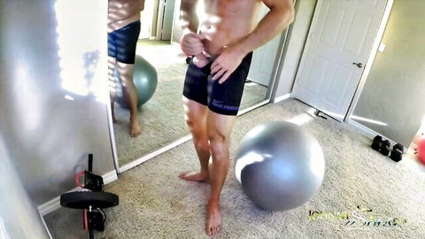 Shirtless muscular bald hunk grabs huge cock bulge in tight gym shorts mirror selfie