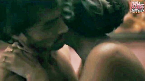 Bearded Indian man gropes topless woman's big tits while kissing her neck passionately