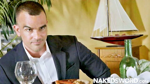 Damien Crosse in sharp suit at dinner, intense stare, gay porn preview