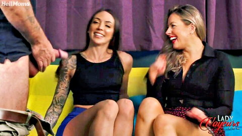 Leila Lani and Brianna Olivia smiling with exposed cock in threesome tease