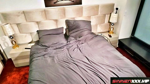 Luxurious bedroom with messy gray sheets on king bed ready for hot sex