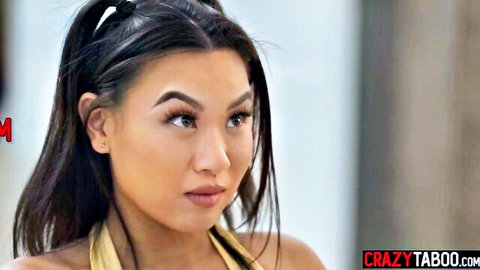 Petite Asian beauty with pigtails in seductive yellow tube top gaze
