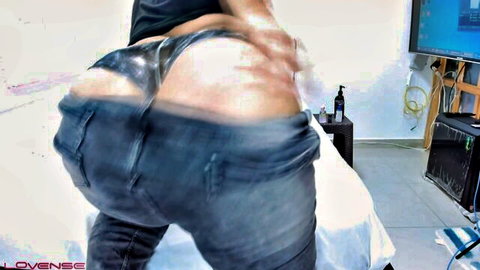 Muscular man bends over exposing huge shiny oiled ass cheeks with jeans pulled down