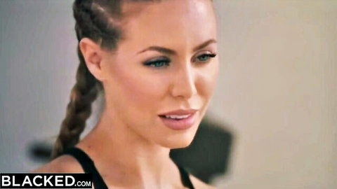 Seductive blonde with braids smirking in tight black top on Blacked.com