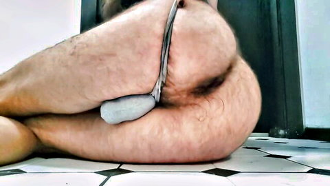 Hairy man's exposed asshole stuffed with thick white dildo toy insertion