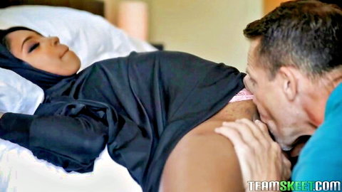 Hijabi Arab woman in niqab gets her big tits sucked by white guy on bed