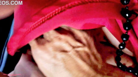 Mature MILF handjob under red towel during erotic massage with black beads necklace