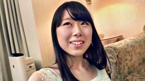 Smiling Asian woman with long black hair in lace blouse, JAV thumbnail