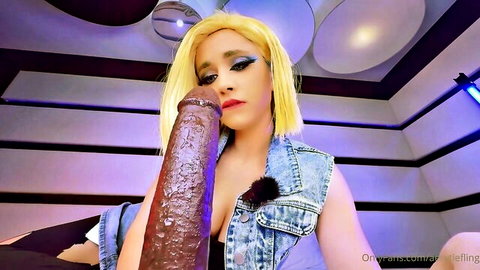Blonde babe kissing thick brown dildo with lips in open denim vest teasing suck