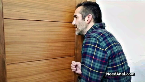 Plaid shirt guy peeking through wooden door spying on anal action