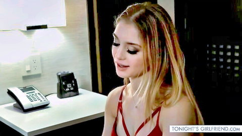 Blonde teen in red bra lingerie smiling seductively at hotel desk