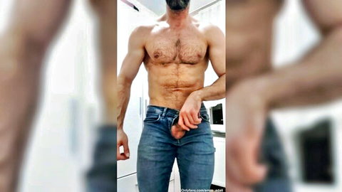 Hairy muscular bearded daddy exposes his thick hard cock from unbuttoned blue jeans mirror selfie