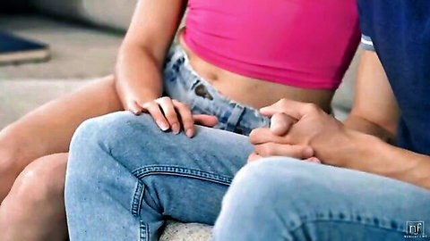 Intimate couple holding hands, young woman in pink crop top and denim shorts from NubileFilms Girl Problems