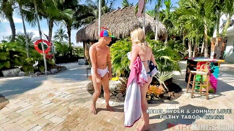 Rebel Rhyder and Johnny Love tease in towels and briefs poolside
