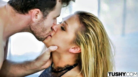 Abby Cross passionately kissing bearded man in black lace lingerie
