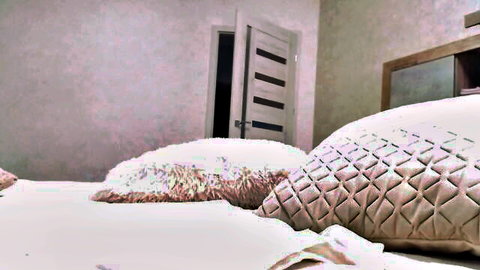 Serena_Kiss seductive bedroom setup with plush pillows on MyFreeCams