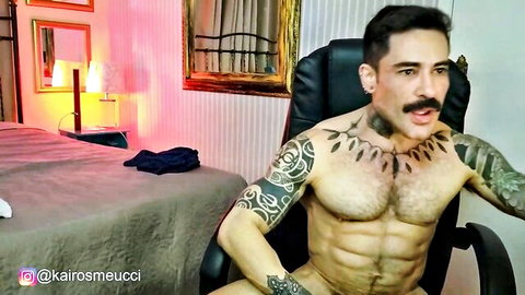 Hunky tattooed Kairos Mucci oiled and nude in solo gay cam show