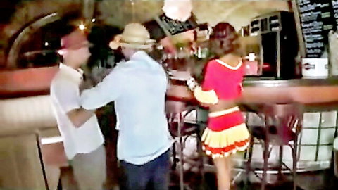 Sexy ebony babe in tiny red skirt groped by two guys at bar