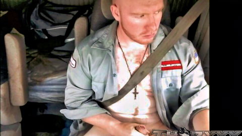 Bald fair-skinned man with beard strokes thick hard cock in truck cab wearing open military shirt