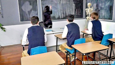 Valentina Nappi as sexy Italian teacher writing on board with uniformed students in class
