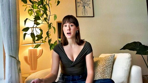 Jules in low-cut black top showing cleavage during tea time chat, solo tease