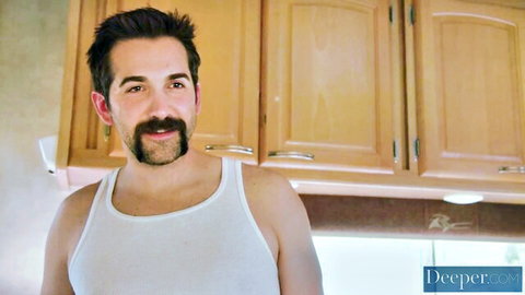Donnie Rock in white tank top, muscular build, kitchen setting from creampie scene with Riley Nixon
