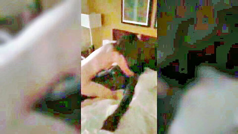 Woman on bed with giant black shoe fetish play