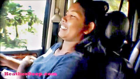 Smiling Asian amateur college teen in car, teasing blowjob vibe