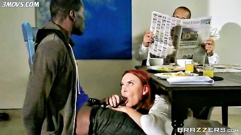Janet Mason sucking stepson's black cock under table while husband reads paper