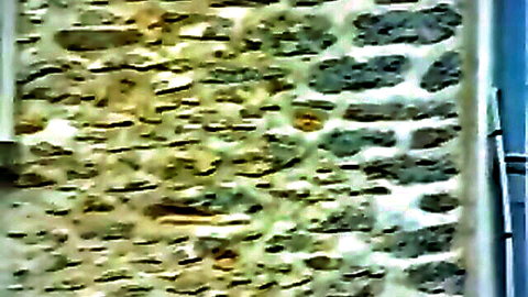 Vintage 1980 boarding school exterior stone wall scene
