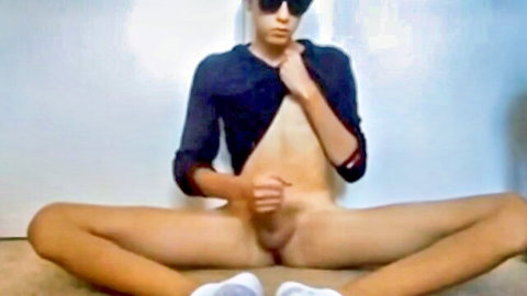Slim twink in open shirt spreading legs exposing cock