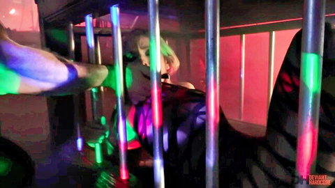 Christie Stevens in neon-lit extreme domination BDSM scene