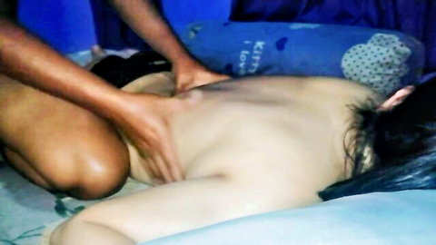 Nude Asian woman gets bare ass massage from dark-skinned masseur