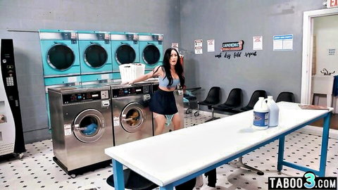 Brunette MILF in blue bra and mini skirt bends over laundry table teasing ass in public laundromat