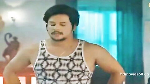 Muscular Indian hunk in tight patterned tank top flexing arms