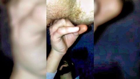Close-up of hand gripping hairy erect cock in gay bareback scene