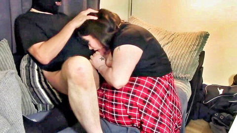 Tina Snua giving intense blowjob to masked man in plaid skirt