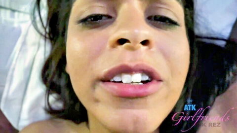 Close-up of mixed Latina woman smiling and moaning in amateur foot fetish video