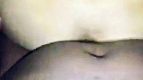 Curvy woman belly close-up in interracial arcade sex video