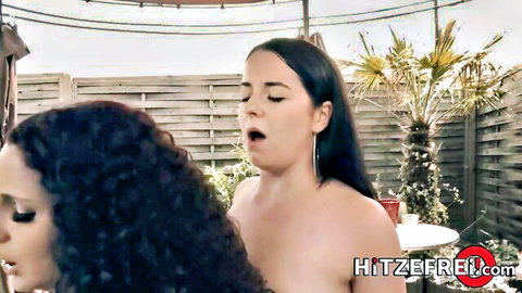 Two busty brunettes with huge tits topless outdoors moaning passionately