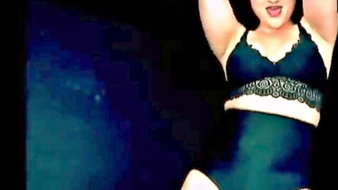 The Mistress B in seductive black lace lingerie, arms raised pose