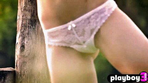 Blonde cougar with natural big tits posing in white lace panties outdoors