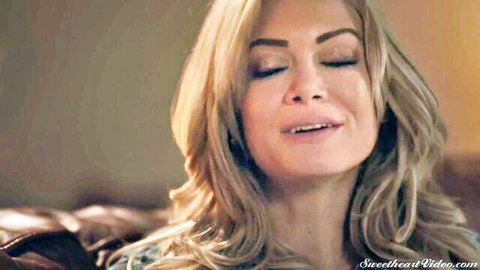 Charlotte Stokely blonde MILF smirking in close-up tease