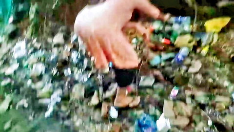 Desi girl bends over trash in shorts as hand reaches for her in amateur Indian hookup