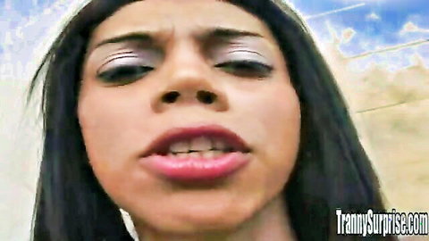 Surprised Brazilian tranny close-up with dark hair and glossy lips